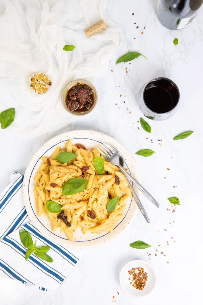 Plate of cauliflower, roasted garlic & sun-dried tomato pasta.