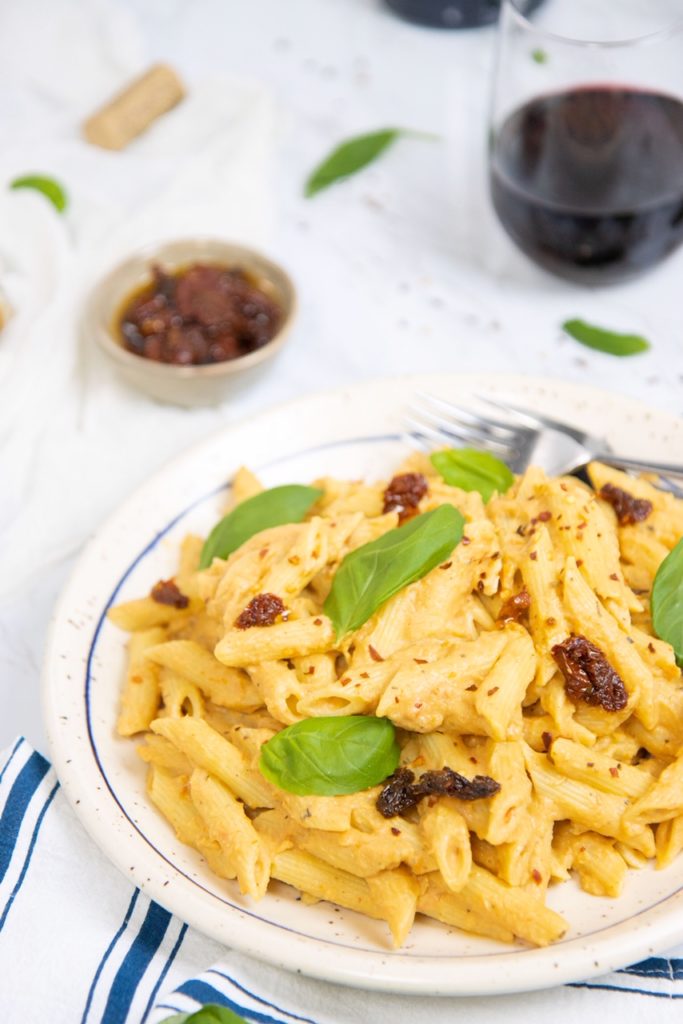 Plate of cauliflower, roasted garlic & sun-dried tomato pasta.