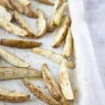 rosemary potato wedges on a baking sheet