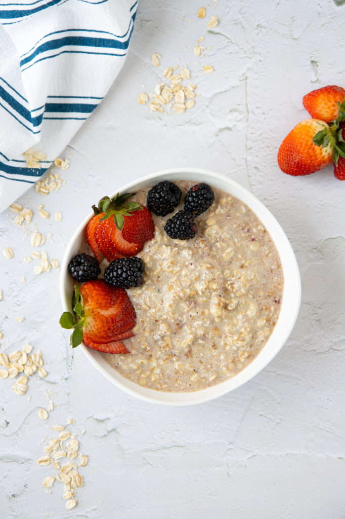 PB&J overnight oats in a bowl with berries