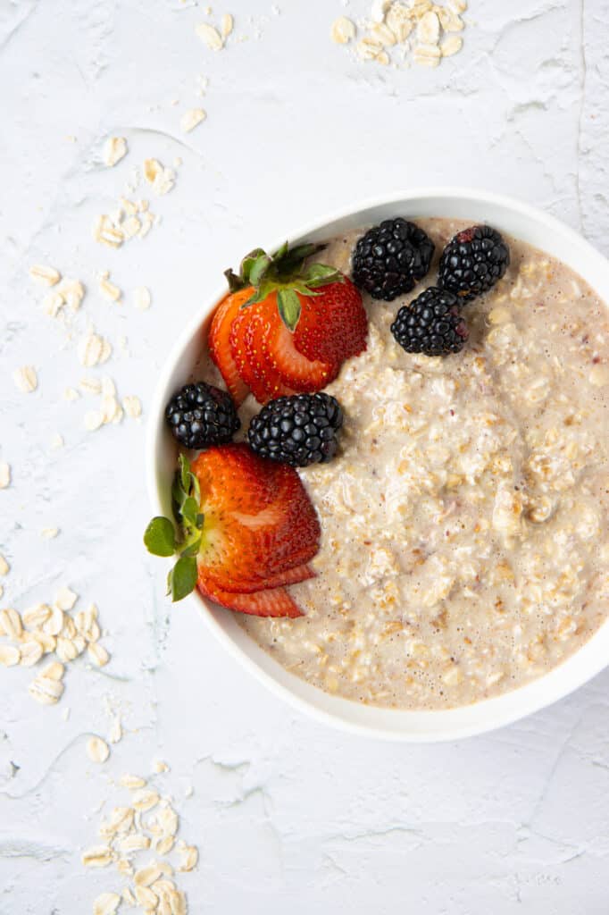 PB&J overnight oats in a bowl with berries