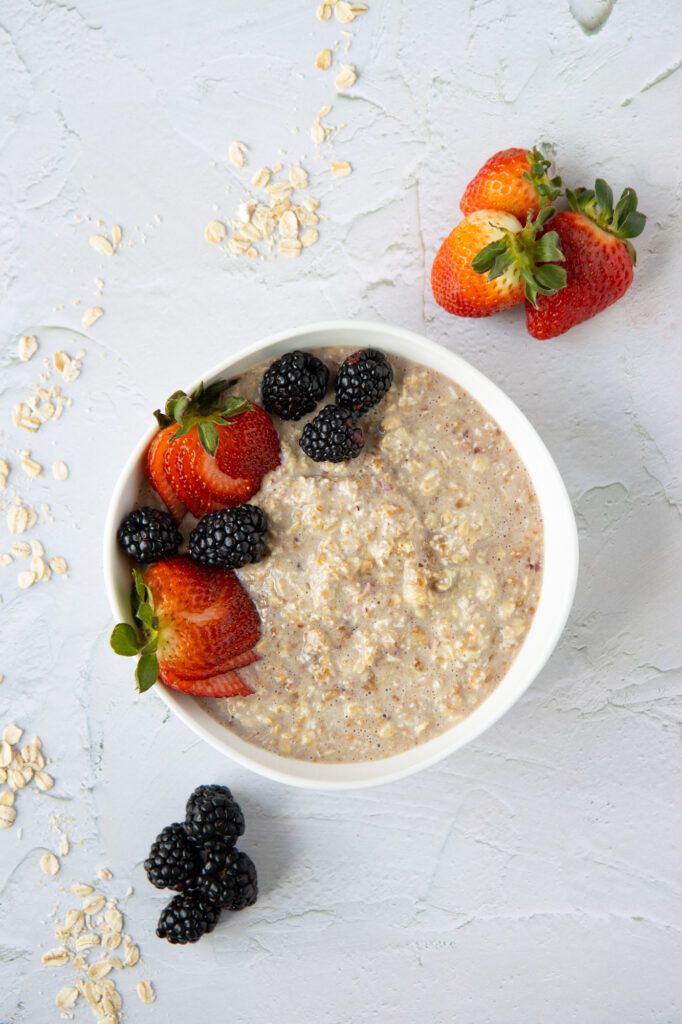 PB&J overnight oats in a bowl with berries