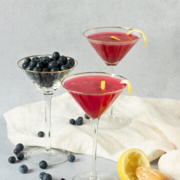 Blueberry lemon drop martinis in martini glasses