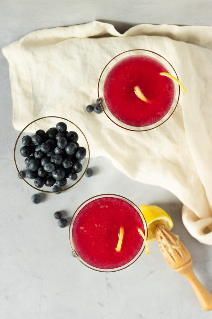 Blueberry lemon drop martinis in martini glasses