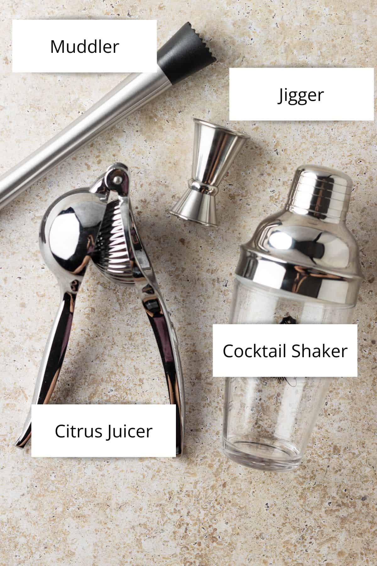 Cocktail equipment including a muddler, jigger, citrus juicer and cocktail shaker.