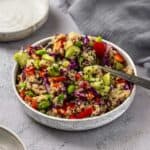 Easy edamame quinoa salad with sesame ginger dressing in a bowl.