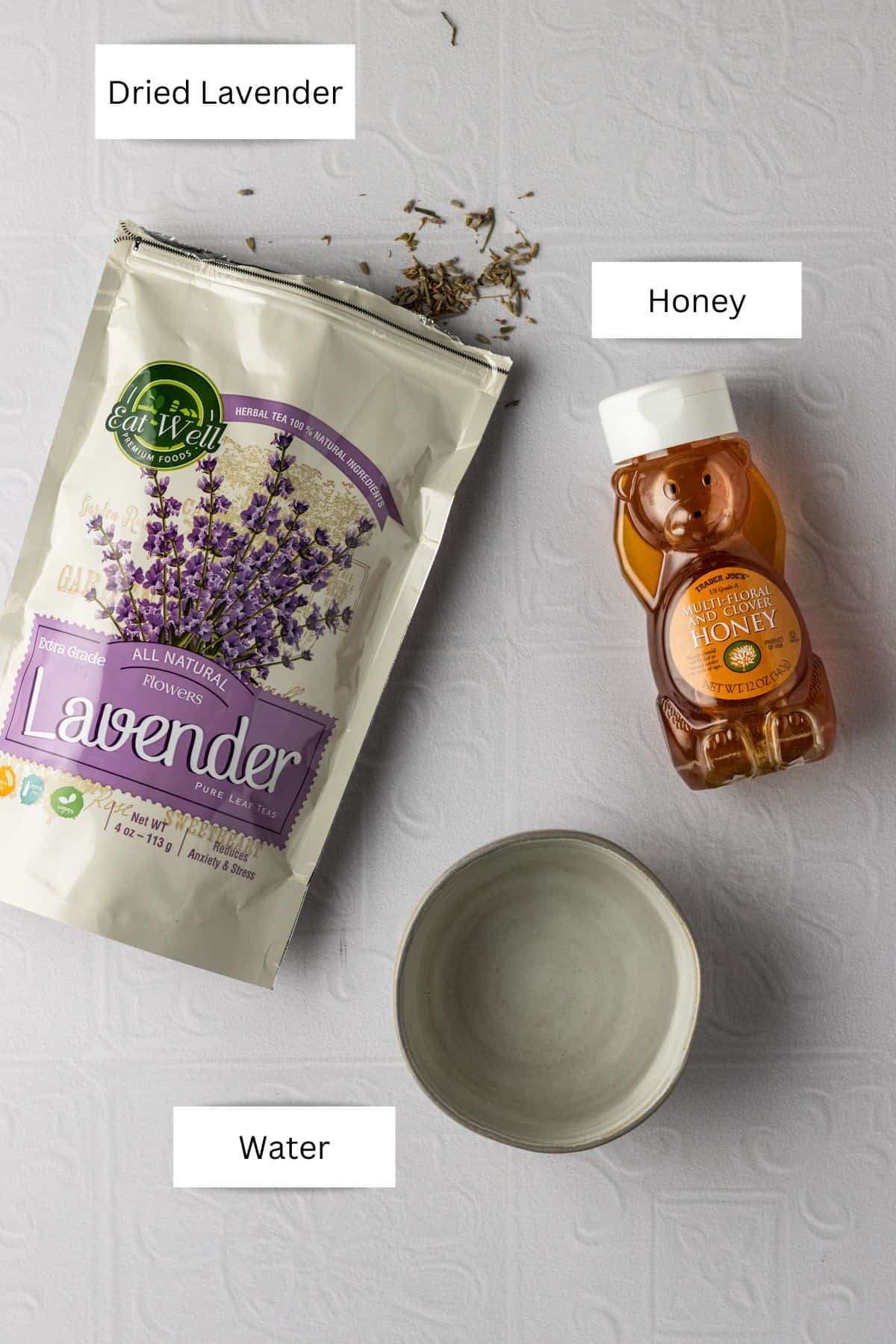 Labeled ingredients needed to make honey lavender simple syrup.