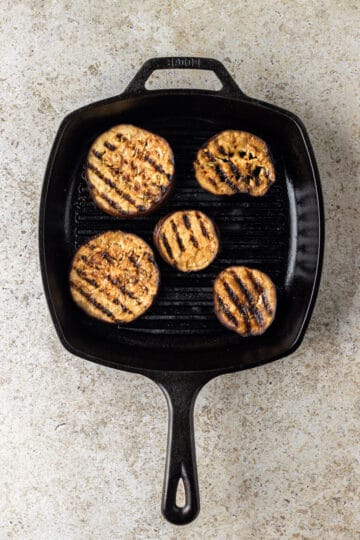 A lodge cast iron grill pan with grilled eggplant slices.