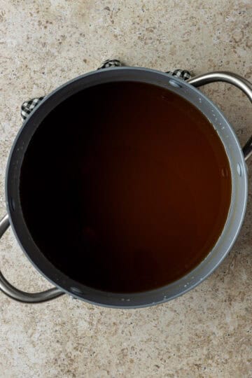 A large stockpot with vegetable broth.