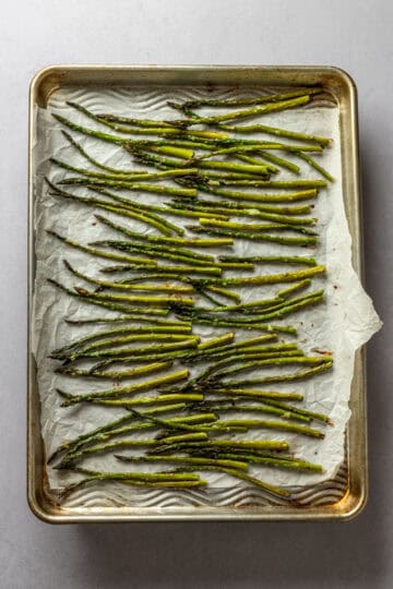 A sheet pan of roasted asparagus.