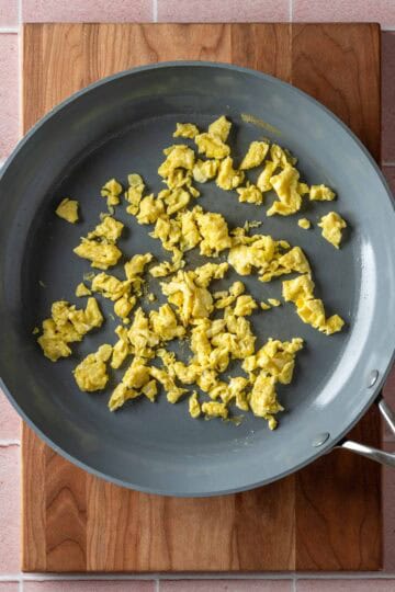 Scrambled egg in a frying pan.