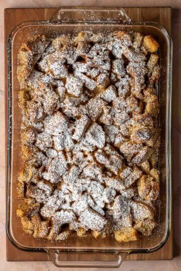 A 9x13 glass baking dish with baked French toast casserole.