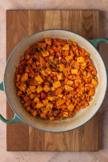 A pot of sautéed vegetables and spices.