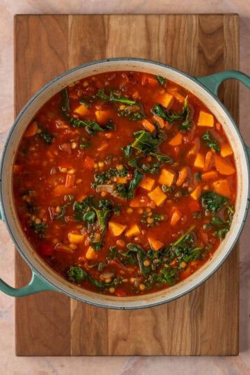 A large pot of veggie soup with lentils.