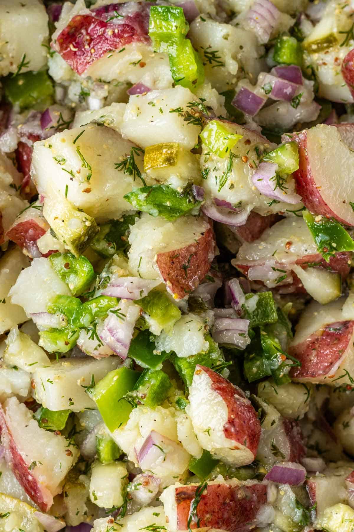 Potato salad with pickles and veggies.