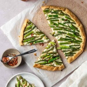 An asparagus galette sliced and ready to serve.