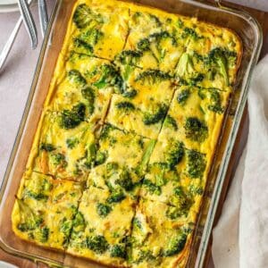 Broccoli and cheddar egg bake in a baking dish.