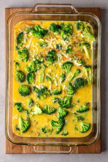 Sautéed vegetables in an egg mixture in a baking dish.